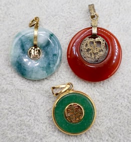 A Grouping of Chinese Gilt Metal Circular Bi Pi Pendants