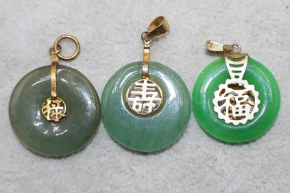 A Grouping of Green Chinese Gilt Metal Circular Bi Pi Pendants