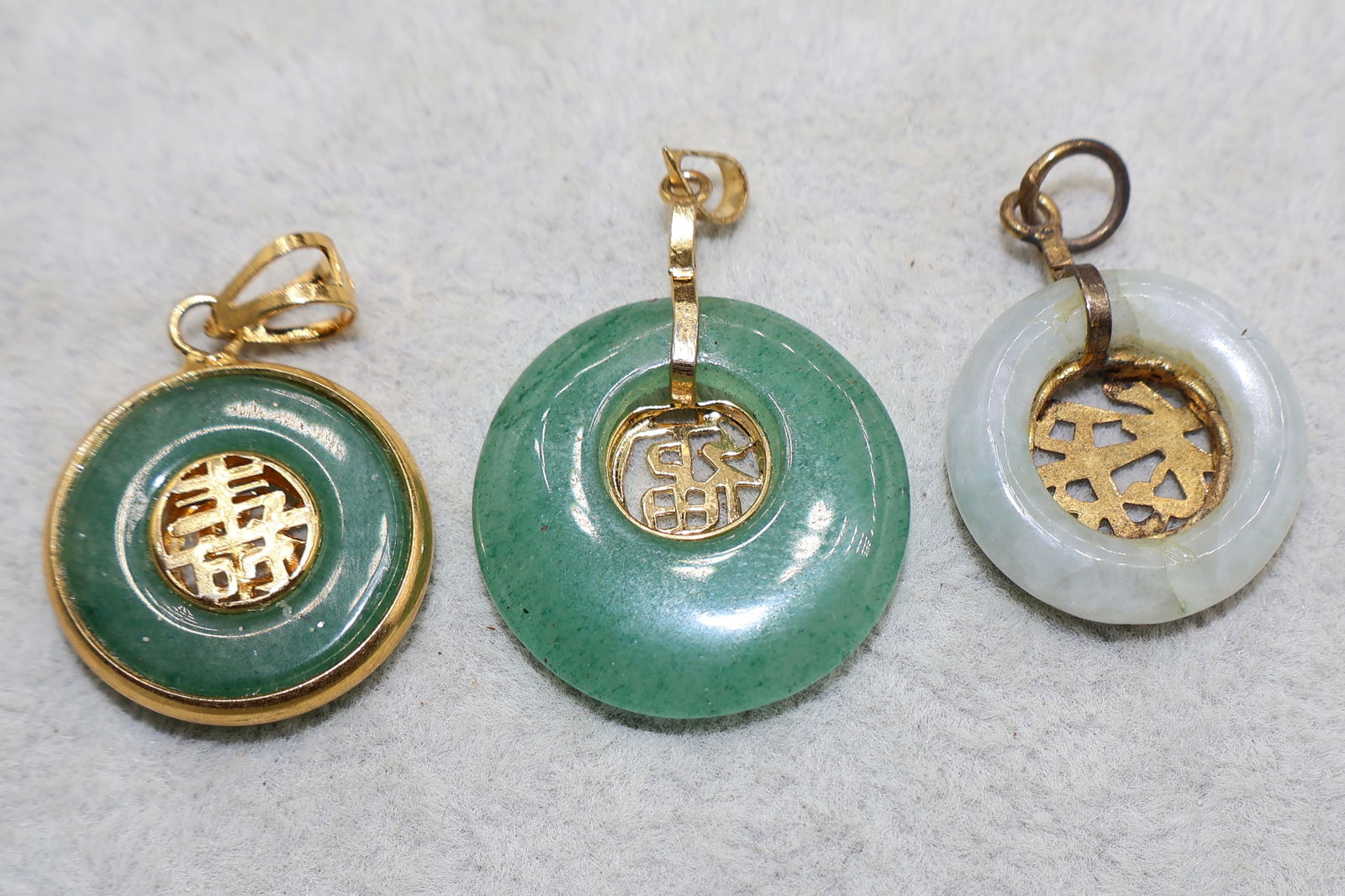 A Grouping of Green Chinese Gilt Metal Circular Bi Pi Pendants (1 of 3)