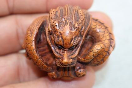 A Finely Carved Japanese Boxwood Dragon Netsuke