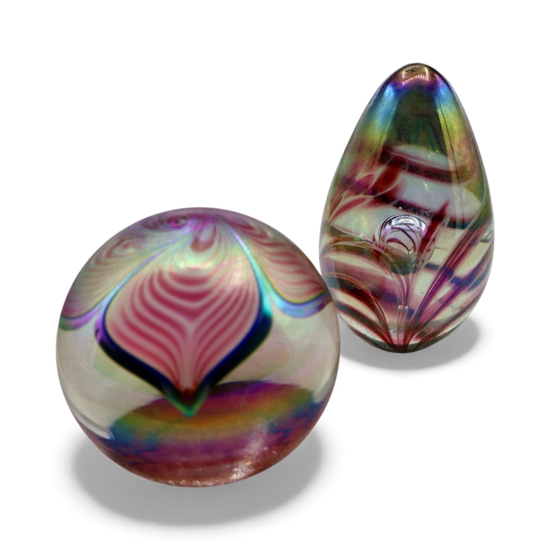 A Beautiful Pair of Iridescent Glass Paperweights: An excellent pair of vintage iridescent glass paperweights by two different glass studios. The first teardrop example was produced by GAS: Glass Eye Studios. The other is knockout example by Stuart Ab