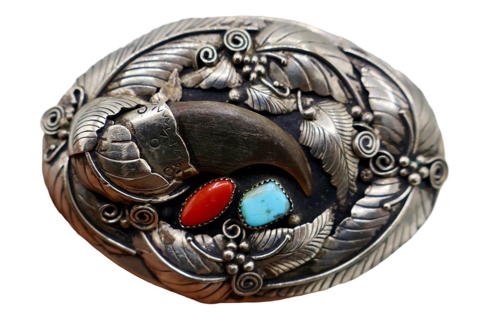 Vintage Navajo Turquoise Coral & Resin Claw Buckle: A beautifully made belt buckle with makers mark to the back. Featuring a faux synthetic resin claw, turquoise, and red coral. Cast from nickel silver.