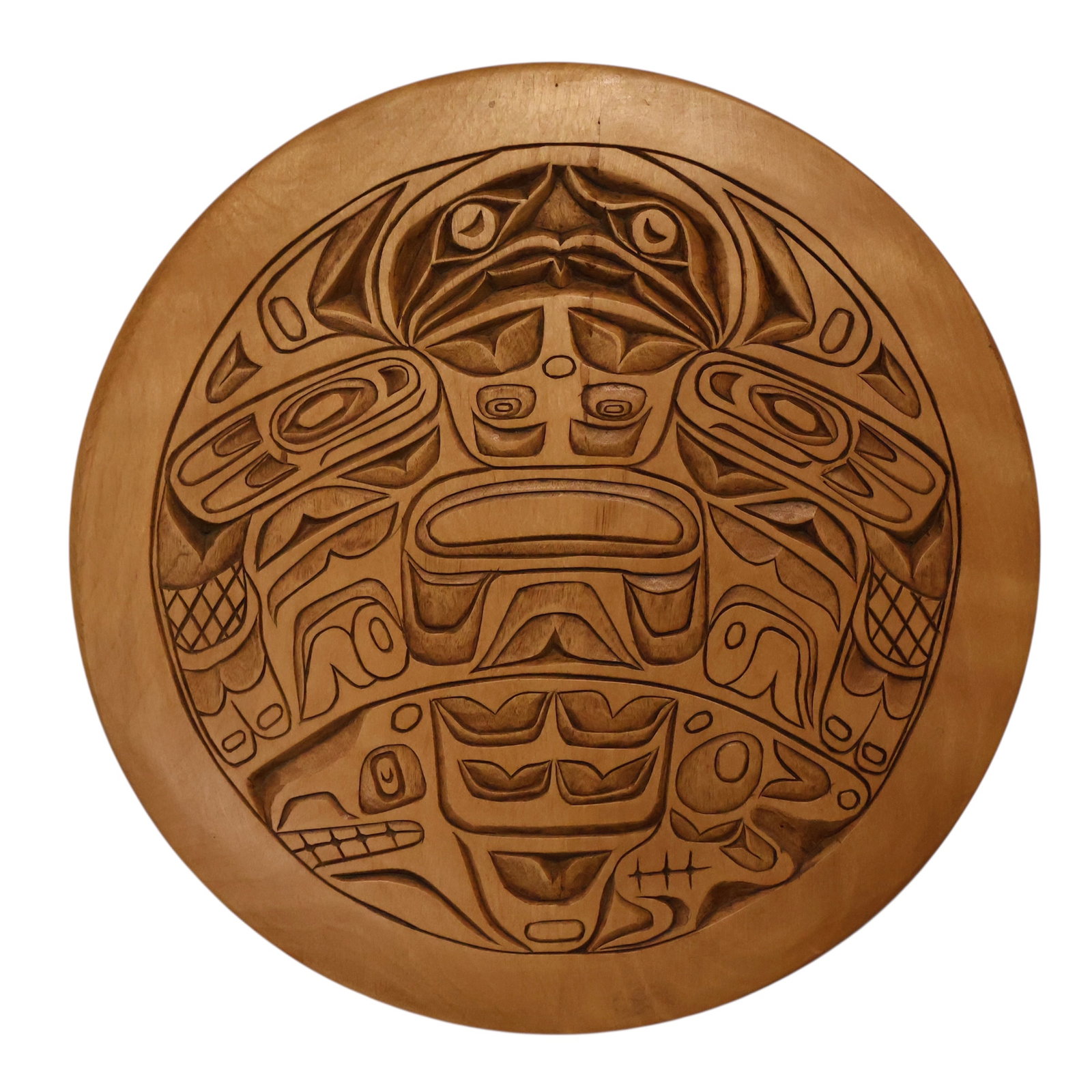 A Signed Northwest Coast Haida Tribe Wood Plaque: Deeply hand carved wooden circular plaque. Features the totem form of the thunderbird on whale. By Haida Artist Jimi Kirk.
