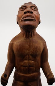A Caribbean Santeria Wood Oche Ritual Figure