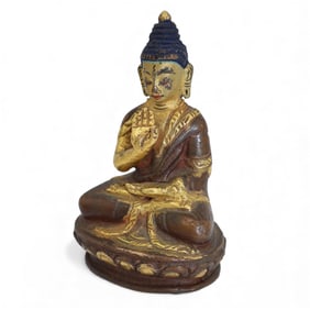 A Miniature Chinese or Tibetan Polychrome Bronze Altar Buddha