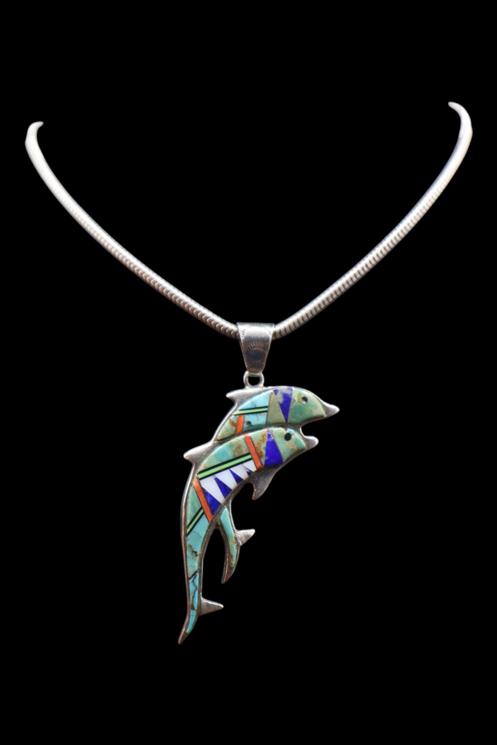 A Large Heavy Chain Handmade Zuni Inlay Dolphin Necklace: Native American, Handmade Dolphin pendant with gemstone inlay. Inlaid with turquoise, lapis, and coral. Heavy and long sterling silver cable chain. Sterling & Lizard Hallmarks.
