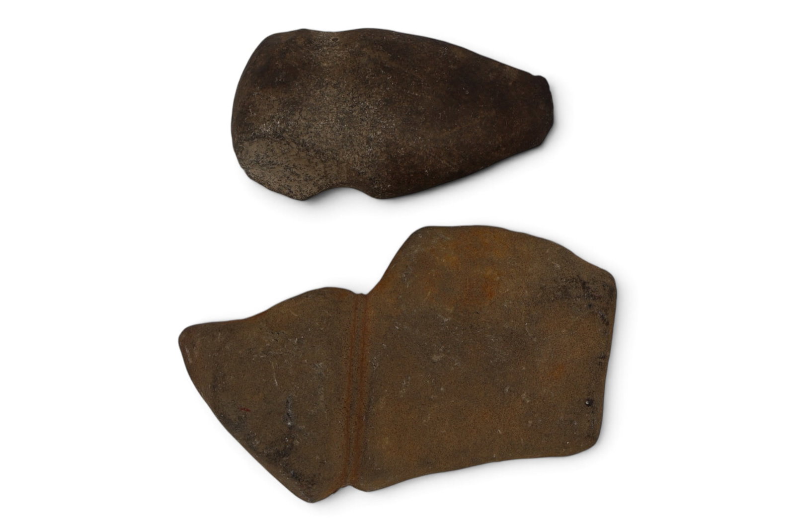A Pair of a Native American Stone Artifacts: A pair of artifacts featuring a field found axe preform and an Axe with a very unusually ground and extended tip area. Ancient. Axe measures: 5.5” x 3 1/4” x 2”. Preform 8”