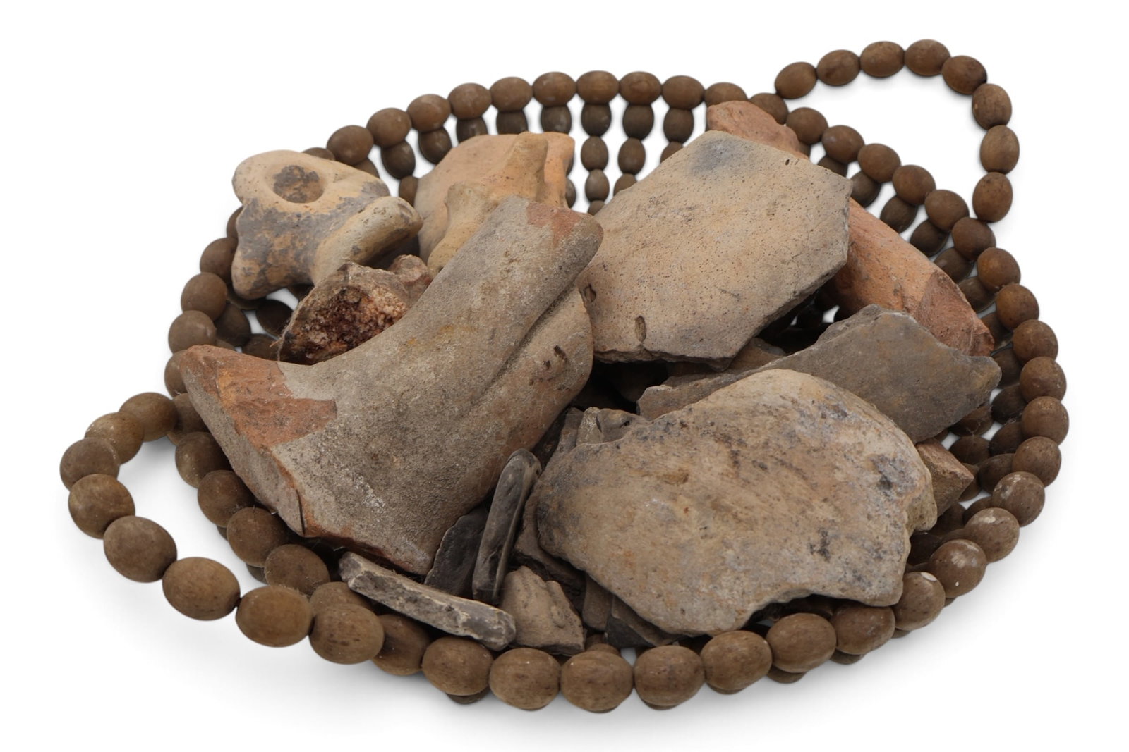 A Grouping of Native American Pottery Vessel Fragments: An assortment of recovered ancient pottery fragments. Some with effigy figures.