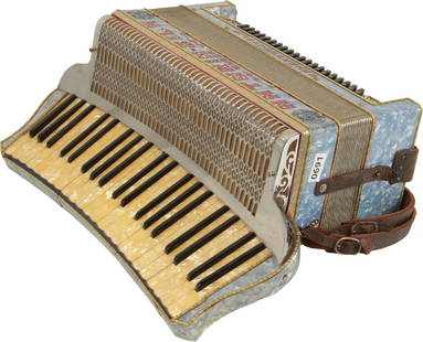 Antoria-Sila, Omega Accordion, Camerano Italia: 41 keys, 120 bass. Curved keyboard 20". Light blue marble case with gold marble keys, red lettering with jewels, metal grille. Comes with leather strap. Made in Italy. Weight 10.2kg. Netting under gri