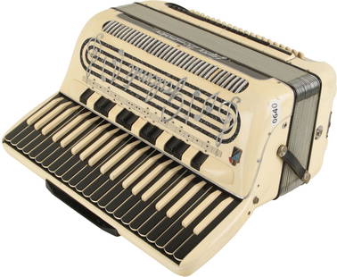 Galanti Super Dominator Accordion: 41 keys, 120 bass. Keyboard 19.5". 15 treble registers, 6 bass. White case with black treble keys, silver lettering and illustration to grille. Made in Italy. Weight 11.8kg. No Visible Damage