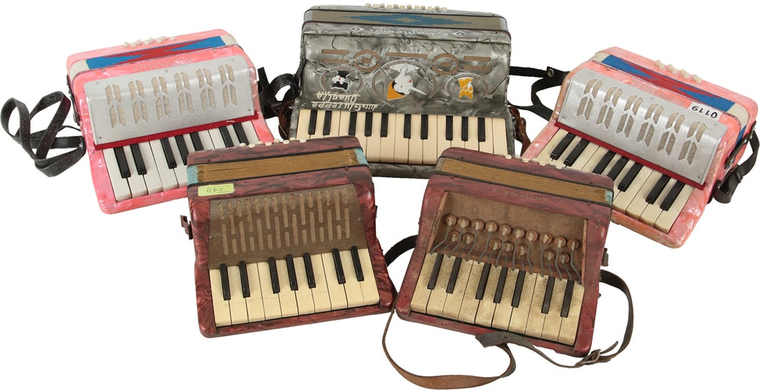 Childrens Accordions: Five childrens accordions in various colours and models: E. Bontempi Pinocchio, Hohner Mignon, Hohner Mignon I, two Stephanelli. No Visible Damage.
