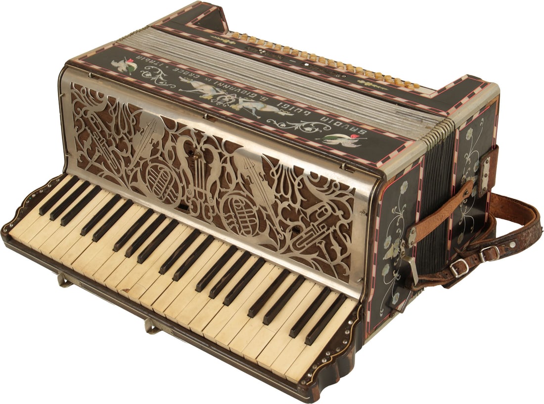 Savoia Luigi S. Giovanni in Croce Italia Accordion: 41 keys, 121 bass. Keyboard 17.5". Black finish, highly decorated with illustrations and jewels. Comes with leather strap. Made in Italy. Weight 10.4. Missing head of one bass button and jewels, stick