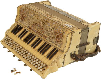 Dallape Stradella Accordion, Italia: 61 keys, 140 bass. Keyboard 16.5", 6 treble registers, 1 bass. Gold marble case highly decorated with illustrations and jewels. Comes with leather strap. Made in Italy. Weight 12.6kg. Missing and deta