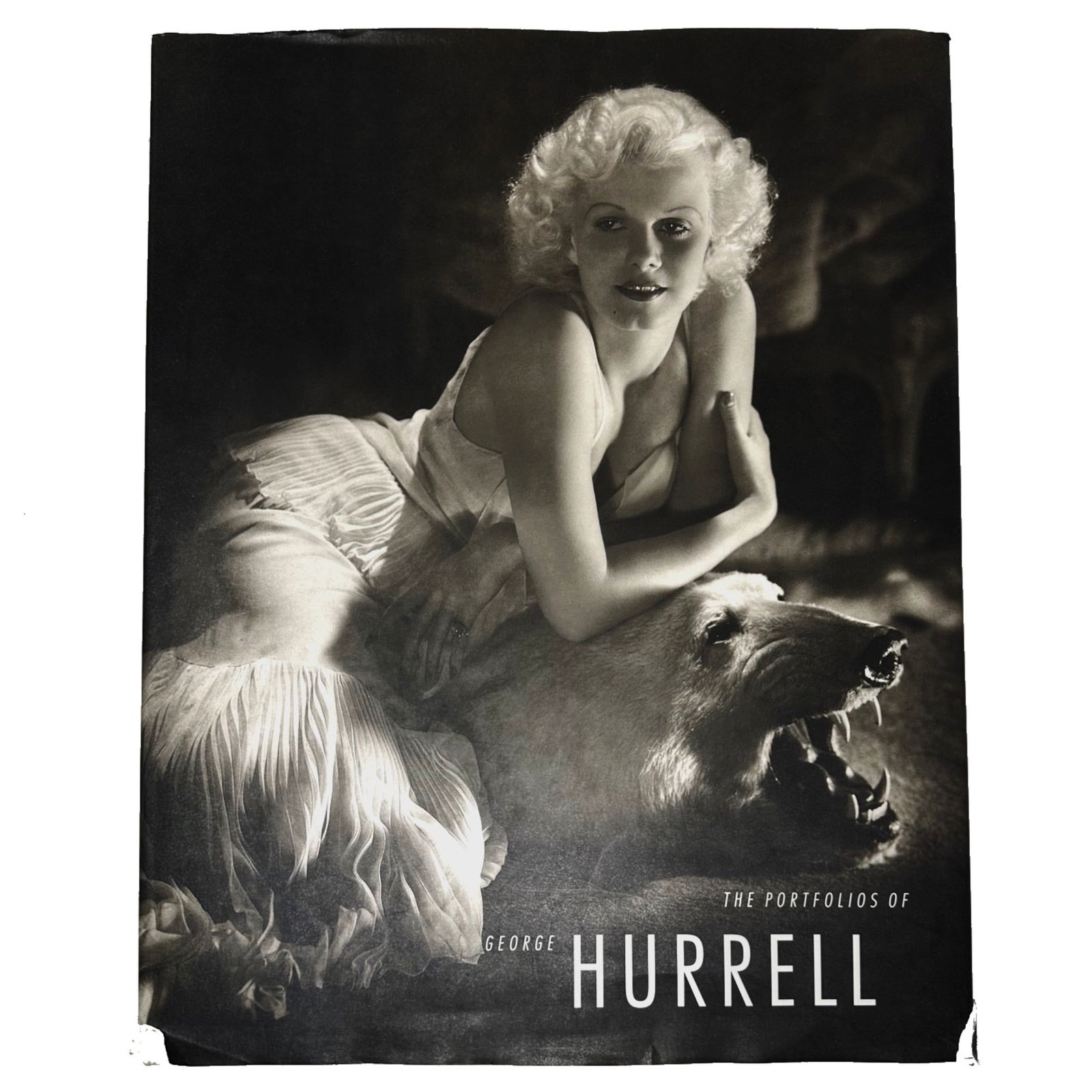 Portfolios of George Hurrell: This lot presents a hardcover edition of The Portfolios of George Hurrell, showcasing the iconic work of legendary Hollywood photographer George Hurrell. Widely regarded as the definitive visual