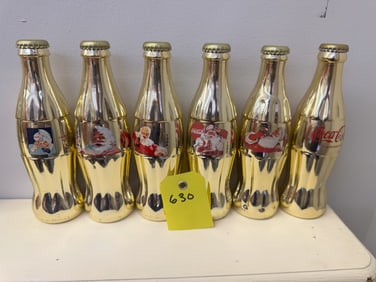 6pk Gold Colored Coca Cola Bottles of Santa Cluas and Sprite Boy