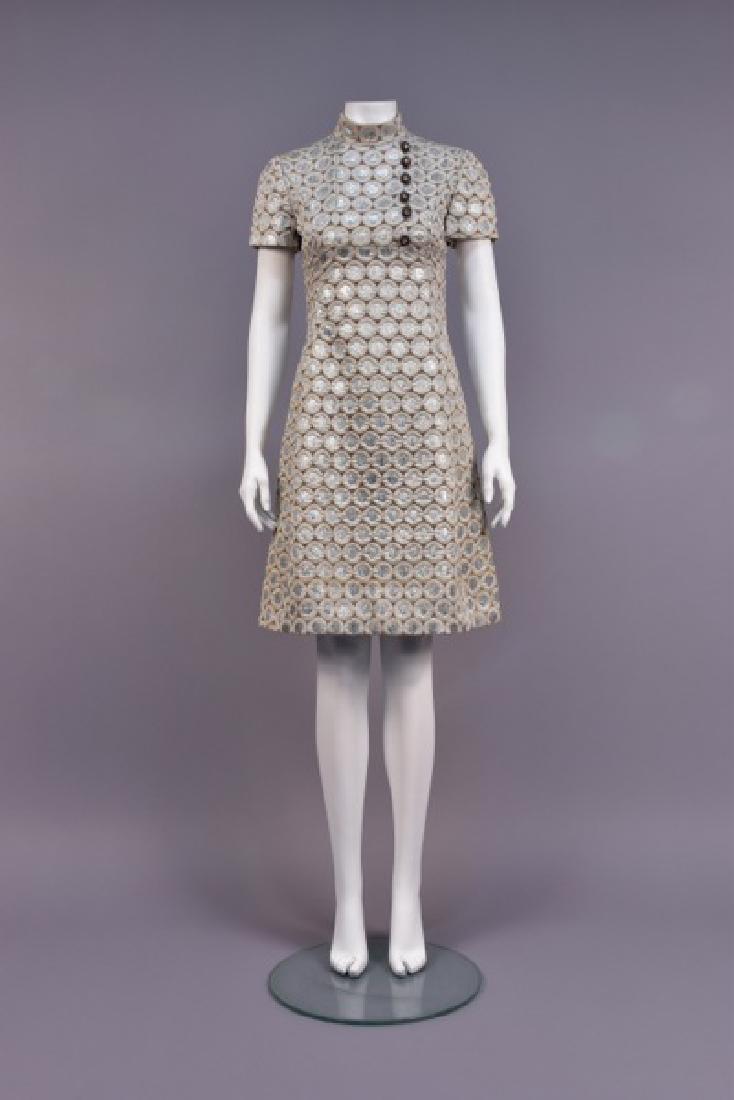 GINO CHARLES METALLIC BROCADE DRESS, 1960s: Short sleeve brown novelty weave having silver-flecked, raised grey circles filled with metallic silver brocade, princess line, stand collar and bib insert with jeweled buttons, hidden vertical pocket