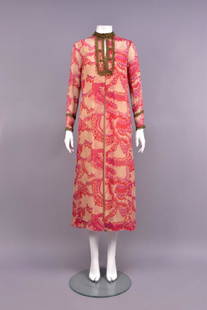 THEA PORTER PRINTED CHIFFON ROBE, c. 1970.: Pale pink silk with stylized butterfly wing pattern in lilac, pink and rose, the band collar, front placket and sleeve trimmed in metallic gold lace, gold cord faux buttons flank hook & eye closures.