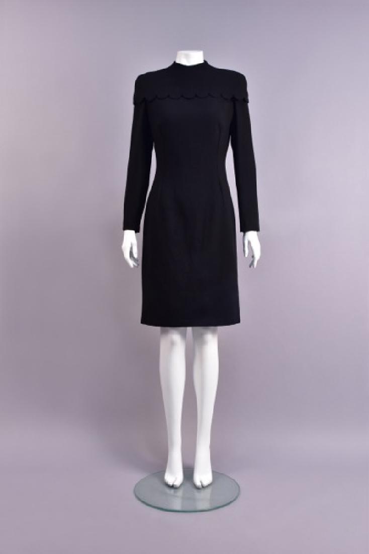GIVENCHY by McQUEEN DAY DRESS with REMOVABLE COLLAR,: Long sleeve black wool crepe having jewel neck, optional cape collar with self buttons at back and scalloped hem, back pleat on skirt. "Couture" label. B-38, W-28, H-38, L-40. Excellent.