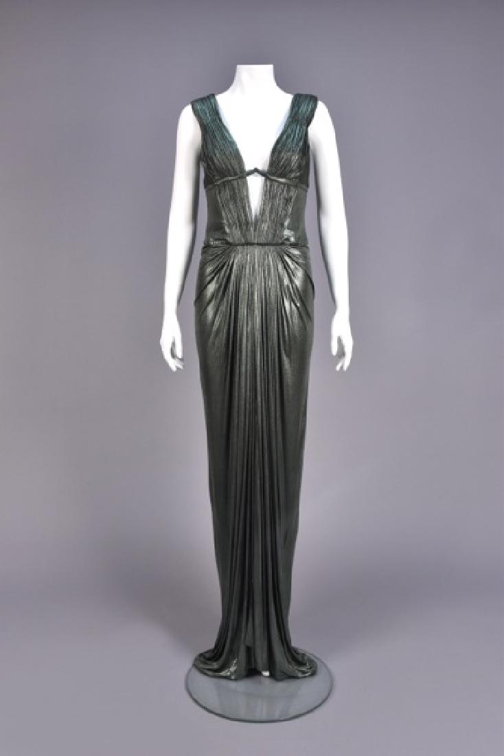 ROBERTO CAVALLI TRAINED METALLIC STRETCH GOWN: Mineral green cupro blend, sleeveless boned bodice, slit to the waist front and back with pleats held by shaped stiffened band, skirt shaped with center front pleats and back ruching. Labeled. B-34, W