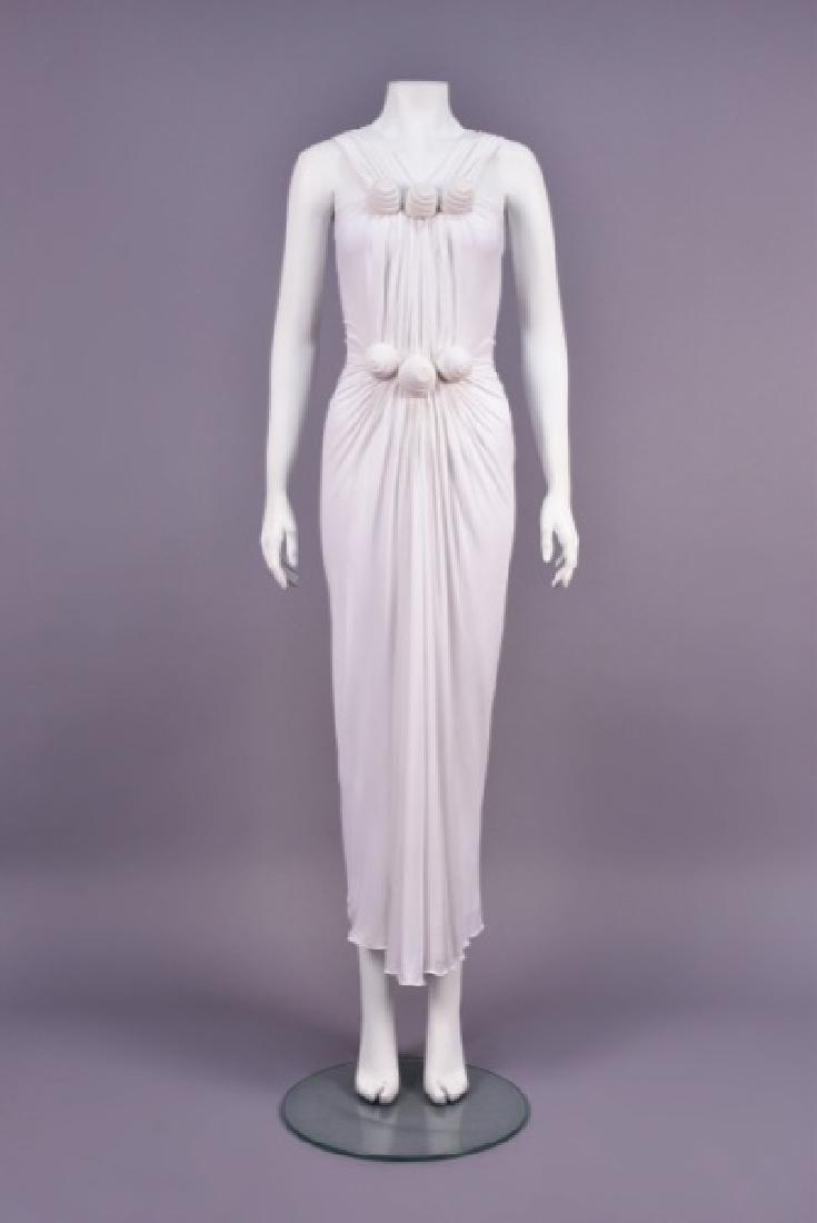 LANVIN ETRUSCAN STYLE GODDESS GOWN: Sleeveless white rayon jersey with gathered front and back V-shaped straps, ruched bodice having raised coils of self fabric above bust and at waist, draped A-line skirt. Labeled. B-32, W-22, L-55. (T