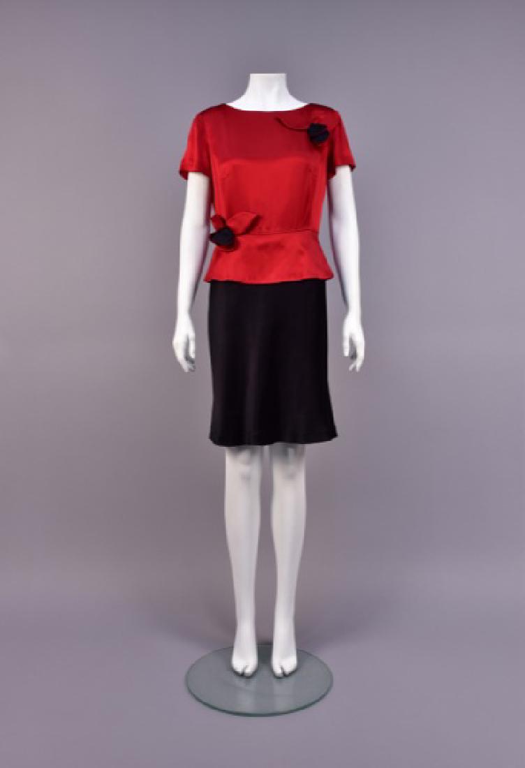 MOSCHINO TWO-TONE SATIN DRESS: Rayon blend having short sleeve, garnet red peplum bodice with black and red floral appliquÃ©s, slit back with button & loop closures, black A-line skirt. Cheap and Chic label. B-40, W-28, H-38, L-3