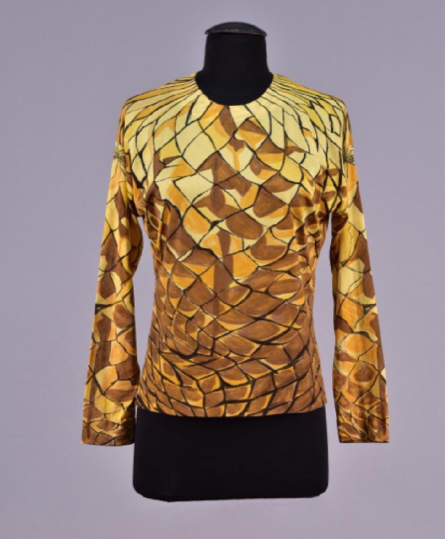 LANVIN PRINTED SILK KNIT T-SHIRT.: Long sleeve yellow jersey having black, brown and gold abstract print, back neck slit with three self button & loop closures. Labeled. B-40, L-22. (Tiny spot on shoulder) very good.