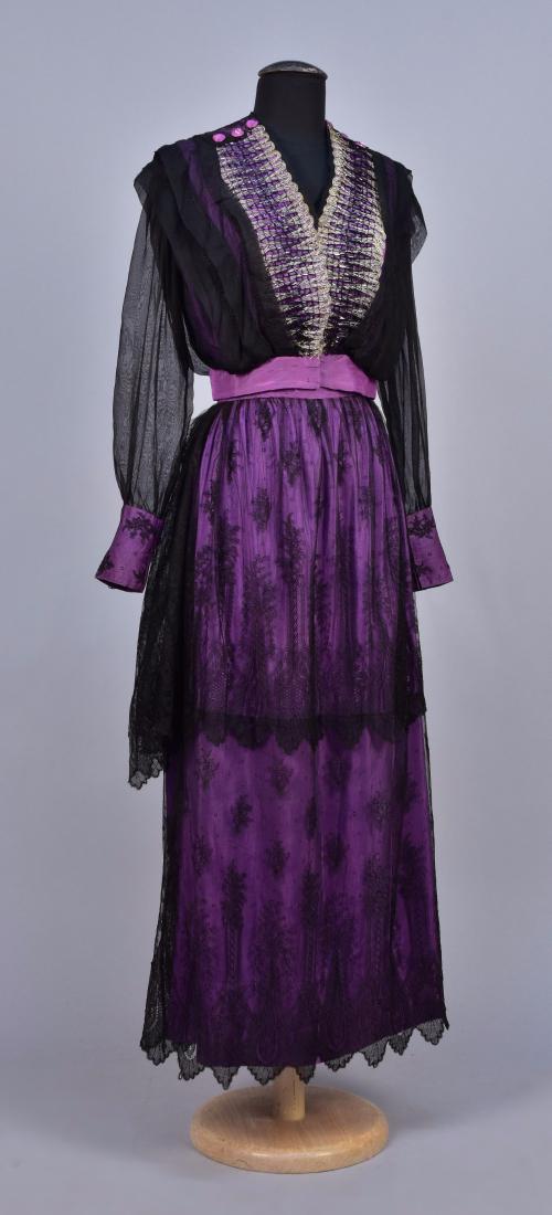 EDWARDIAN SILK and LACE GOWN: 2-piece purple silk, long sleeve bodice with overlay of tucked black chiffon with black and silver metallic embroidery, long sheer sleeve with lace cuff, skirt covered in two tiers of black Chantilly 