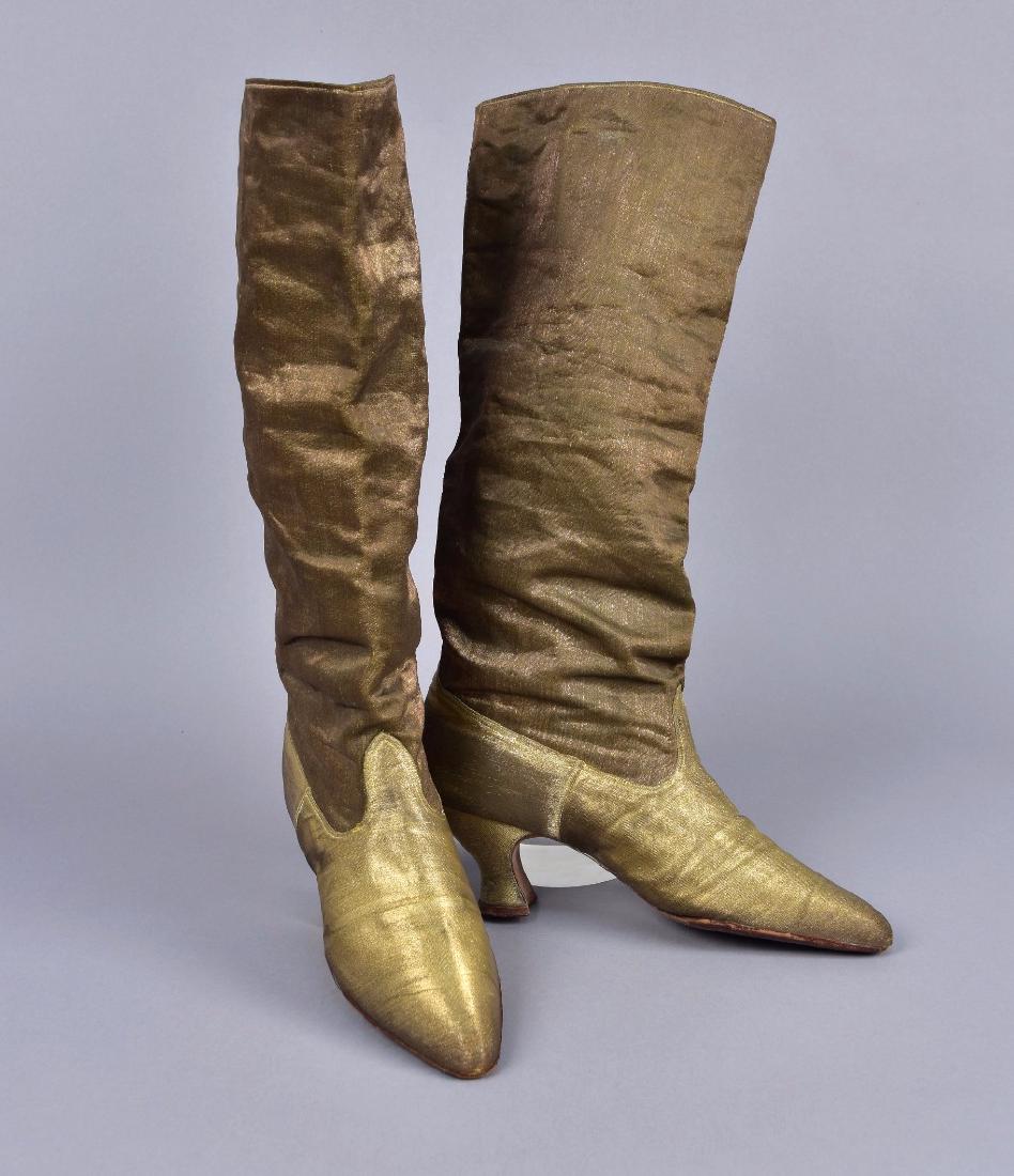 UNUSUAL GOLD LAME BOOTS, probably 1920s: Allover lamÃ© with Louis heel, straight shaft, kid leather interior with cotton pull straps, sole stamped "Miller". 10 x 2 1/4 x 16, 2 1/4-inch heel. (Significant tarnish, one heel abraded at bottom