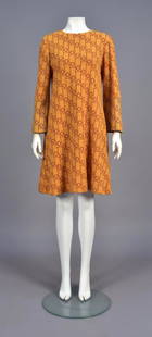 RUDI GERNREICH GEOMETRIC PATTERN KNIT DRESS, c. 1970: Wide A-line in mustard wool with repeating red circles within rectangles, long sleeve having slightly flared cuff with the pattern in purple. Labeled. B-40, L-38. (One sleeve slightly stained at hem,