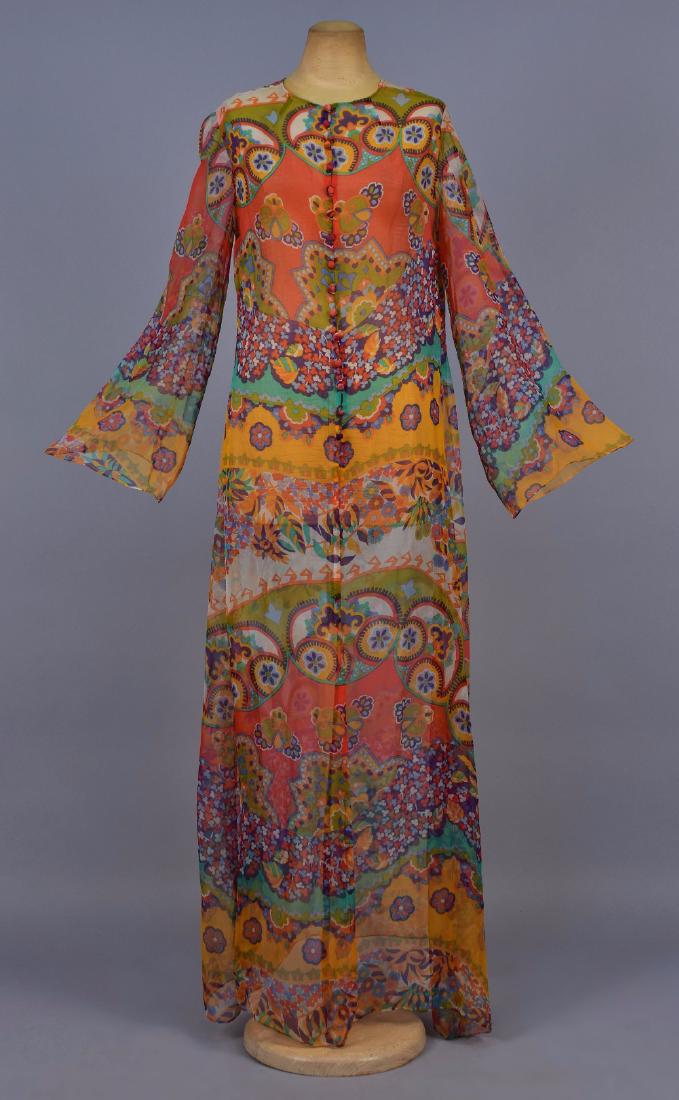 PRINTED CHIFFON CAFTAN, c. 1970: Polychrome flower power print with self button & loop closures, long slightly belled sleeve. Unlabeled. B-40, L-50. (Some wear to buttons) very good. GLC