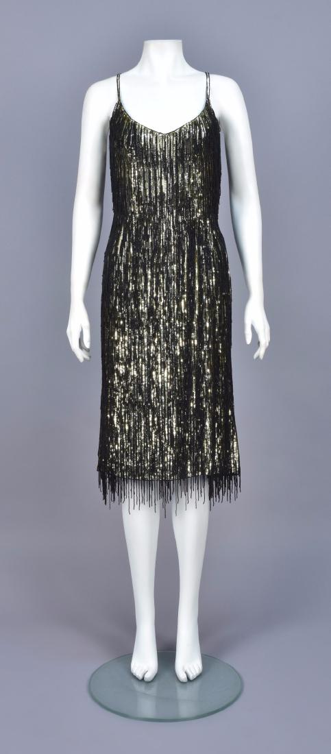 ESCADA SEQUINED DRESS with BEADED FRINGE: Sleeveless sheath with spaghetti strap covered in gold sequins and black beaded fringe of varied lengths, silk lining, stretch interior waistband. Labeled. B-34, W-26, H-36, L-43 1/2. Excellent.