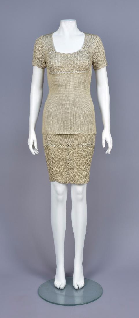 CHRISTIAN LACROIX KNIT ENSEMBLE: Oyster viscose sweater having macramÃ© short sleeve and bust, matching skirt with elastic waist and macramÃ© lower panel. Labeled. B-34, sweater L-25, skirt W 24-34, skirt L-23 (Few minor pulls) e