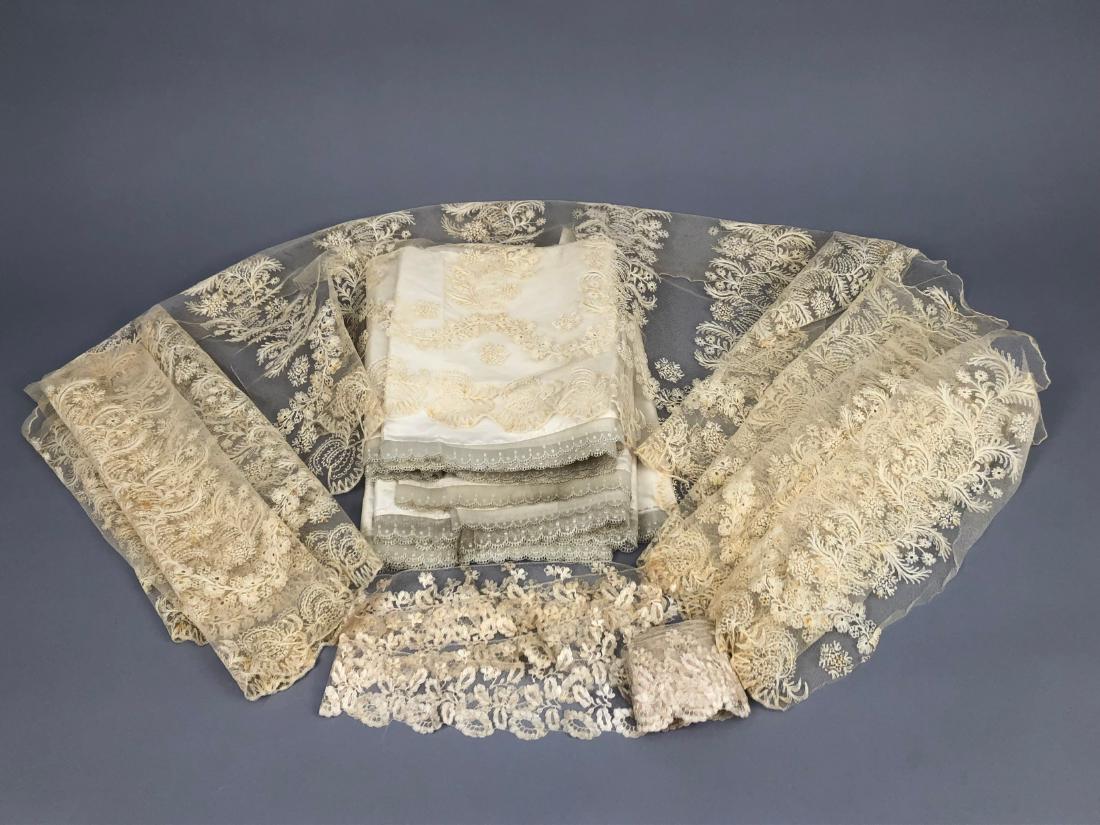 LOT of LACE TRIM, 1830s - 1840s: Handmade silk blonde lace yardage with floral motif, 3 inches x 8 1/2 yards, (some spots, few holes). Linen and silk needlerun skirt flounce having meandering floral repeat and scalloped edge, 20 x 67