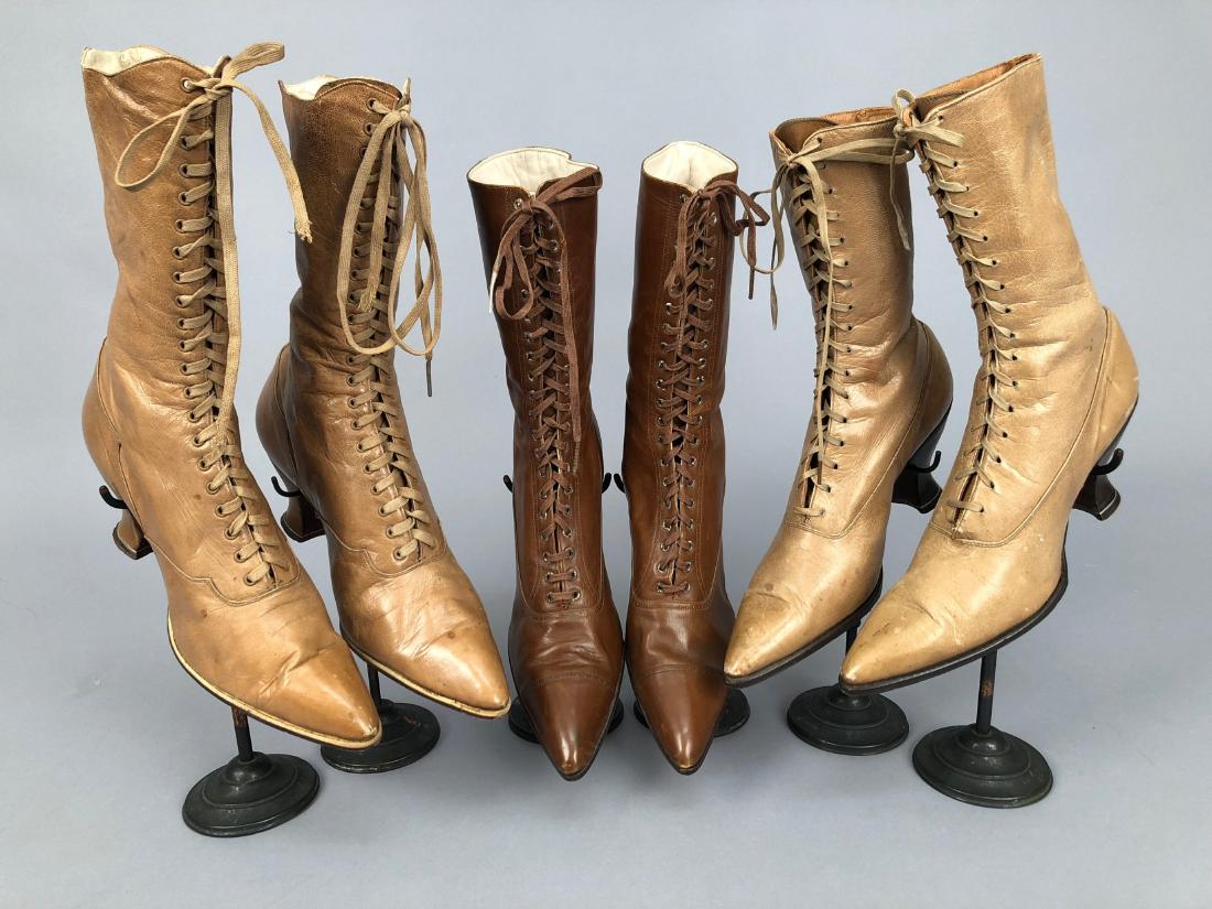 THREE PAIR HIGH-LACING BOOTS, 1890s: All with Louis heel: One tan having stacked wood heel, 9 1/2 x 10, (scuffs and spots); one light brown with shaped vamp and quarter, Union label, 10 1/2 x 11 1/2, (one missing aglet, leather lifting f