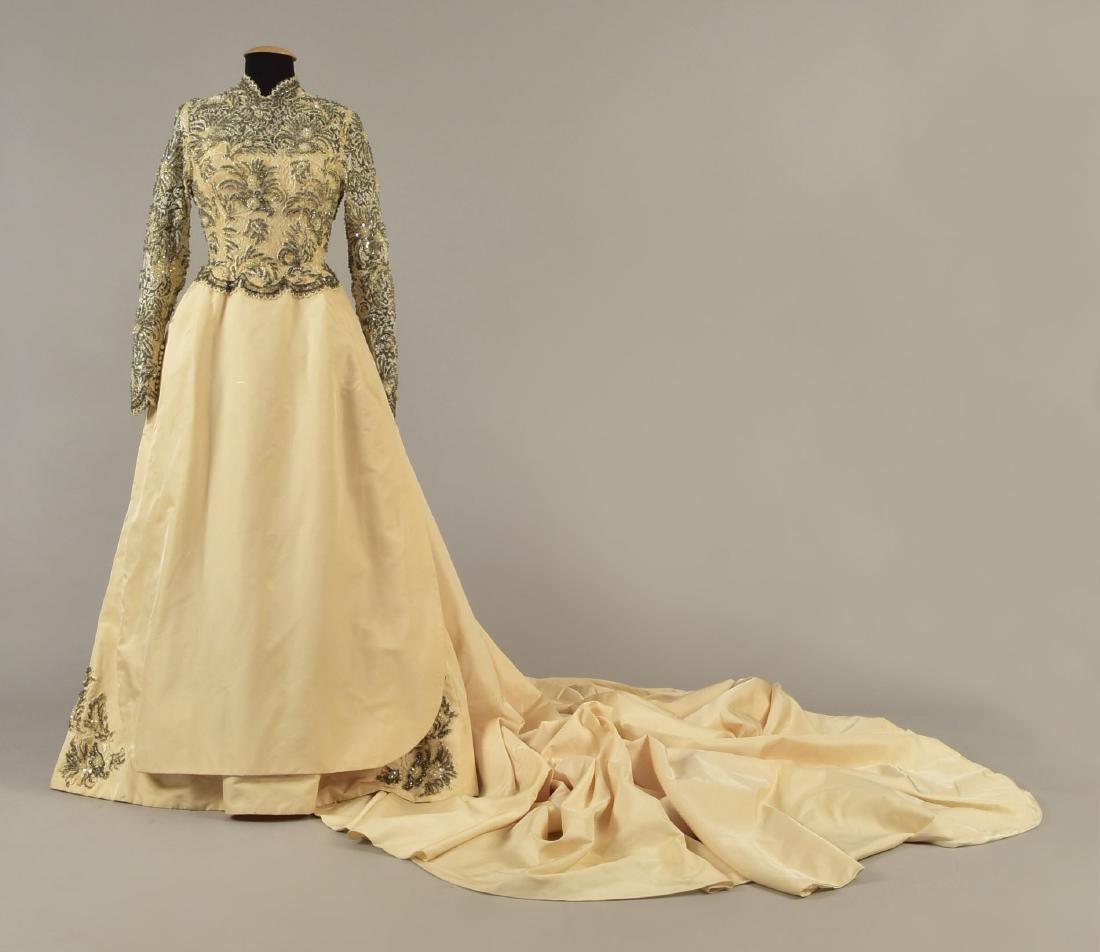 MICHAEL NOVARESE WEDDING GOWN with CATHEDRAL TRAIN,: Cream taffeta, the long sleeve bodice covered in floral lace with sheer top and sleeve, decorated allover in white and clear beads, iridescent sequins and rhinestones, full skirt with slightly shorter