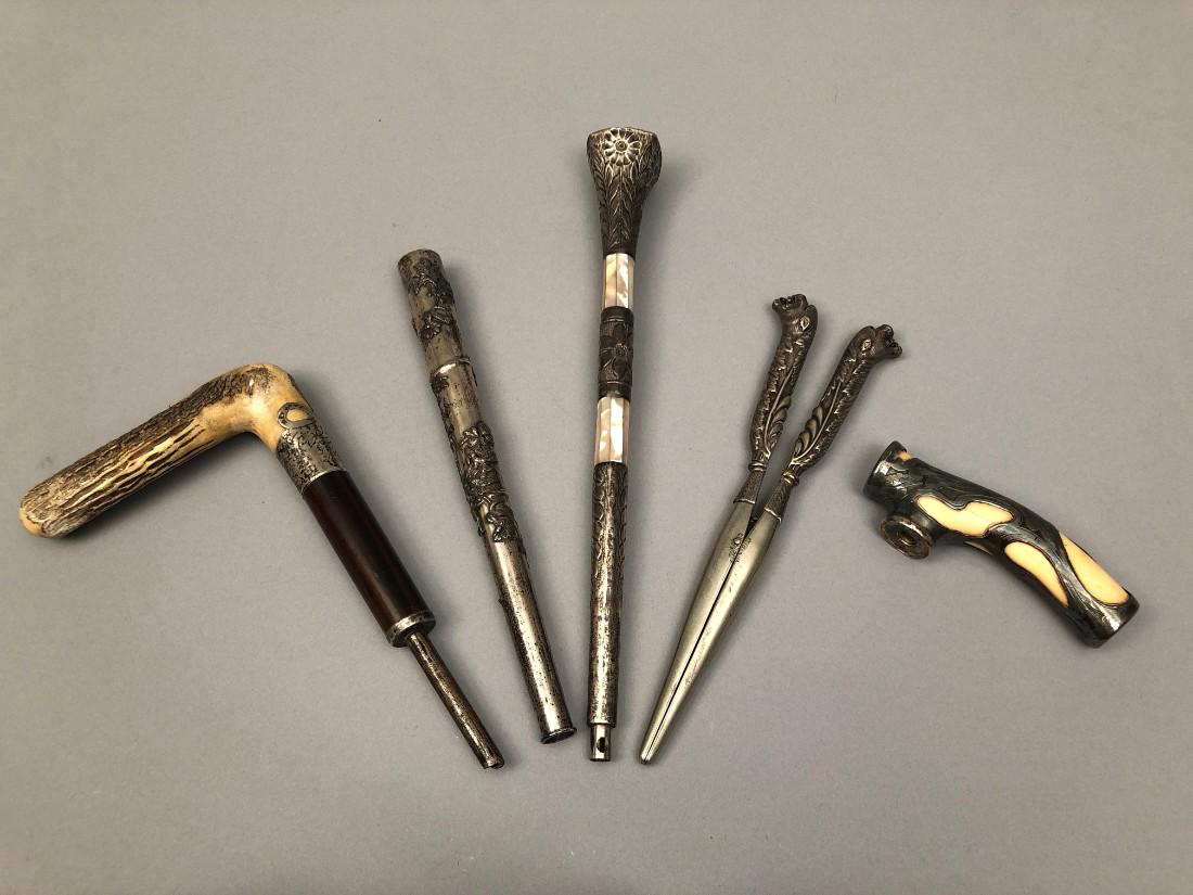 LOT of PARASOL and CANE HANDLES, 19th - EARLY 20th C: Silver or silver metal, some with horn, bone and mother of pearl. Together with a silver metal glove stretcher with a pair of full figural lion heads. Smallest L-4, largest L-10. Good-excellent.