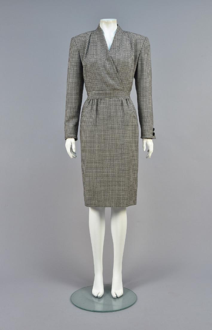 VALENTINO HOUNDSTOOTH CASHMERE DRESS, EARLY 1980s: Black and white with surplice bodice tucked at the shoulder, decorative buttons at wrist, set-in waistband, slightly gathered narrow skirt having side seam pockets, silk lining, Boutique label. B-38, 
