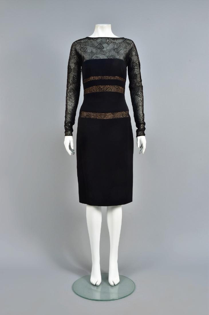 BOB MACKIE SILK and LACE COCKTAIL DRESS: Black silk having bands of black lace with swirls of reflective threads backed in nude fabric, sheer lace bodice top with long sleeve, boatneck and V-back, labeled. B-34, W-26, H-34, L-42 1/2. (Label