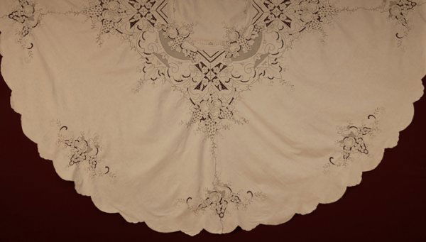 ROUND MADEIRA TABLECLOTH, 1920s-1930s Central circ: ROUND MADEIRA TABLECLOTH, 1920s-1930s Central circular medallion having fruit and flowers within a square, surrounded by smaller flower and fruit clusters, scalloped hem. Ex. Vanderbilt/Emerson family