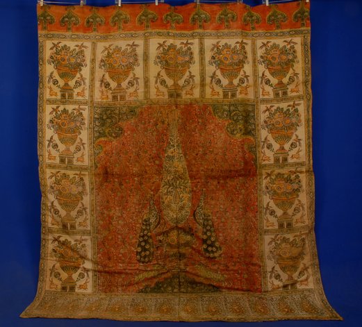 PRINTED COTTON PALAMPORE, EARLY 20th C Two joined : PRINTED COTTON PALAMPORE, EARLY 20th C Two joined panels with central field having urn flanked by peacocks and tigers, all within a border of blocked urns, backed in lightly padded cotton. Some slight