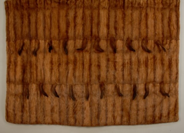 MINK THROW with TAILS, 20th C DDCF. Brown fur piec: MINK THROW with TAILS, 20th C Estate of Doris Duke to benefit DDCF. Brown fur pieced in a striped pattern with two rows of tails, backed in brown acetate. 50 x 71. Excellent.