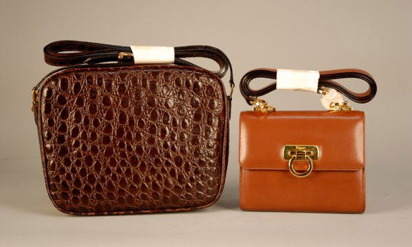 TWO DEADSTOCK FERRAGAMO HANDBAGS, LATE 20th C Smal: TWO DEADSTOCK FERRAGAMO HANDBAGS, LATE 20th C Small brown leather with brass ring hardware. Cordovan crocodile with zip closure and shoulder strap. Pristine.