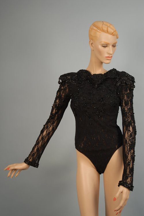 LADY'S BLACK BEADED BODY SUIT and QUILTED PANTS, 1: LADY'S BLACK BEADED BODY SUIT and QUILTED PANTS, 1970s Estate of Doris Duke to benefit DDCF. Lace knit long sleeve body suit with back snap closures and zipper has scalloped collar and shoulder overla