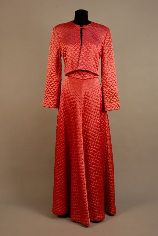 QUILTED SATIN LOUNGING SKIRT and JACKET, 1940s DDC: QUILTED SATIN LOUNGING SKIRT and JACKET, 1940s Estate of Doris Duke to benefit DDCF. Rose colored long, full skirt with back zipper and long satin ties attached through loops. Matching bolero with sli