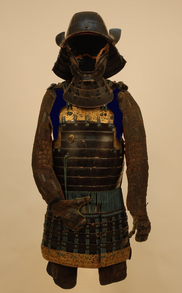 SAMAURI GUSOKU, JAPANESE ARMOR, MEJI PERIOD. Consi: SAMURAI GUSOKU, JAPANESE ARMOR, MEJI PERIOD. The suit consisting of a Zunari hinero Kabuto in dark chestnut brown lacquer with truncated Koshimaki and four lame Sikoro, the last lame having textured g
