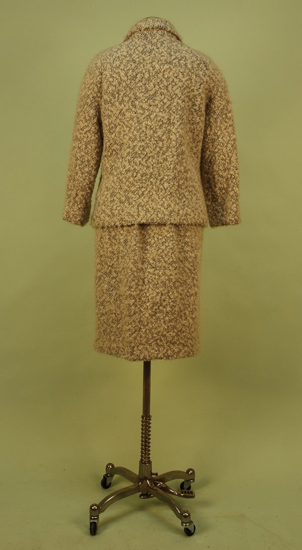 GUY LAROCHE WOOL TWEED SKIRT SUIT, LATE 1960's. Wh: GUY LAROCHE WOOL TWEED SKIRT SUIT, LATE 1960's. White with black loose weave tweed having raglan three- quarter sleeve, large black plastic buttons, narrow over the knee length skirt with two side zip