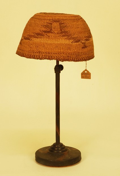 NATIVE AMERICAN MODOC WOMAN'S CEREMONIAL HAT, c. 1900. : NATIVE AMERICAN MODOC WOMAN'S CEREMONIAL HAT, c. 1900. Upper Klamath Lake region of Oregon. Twined basketry with stepped rectangular design, having old trading post tag. 6 1/2 x 3 3/4. Excellent.