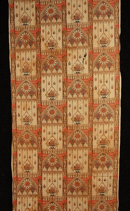 ENGLISH ROLLER PRINTED COTTON, c. 1850. In a patte: ENGLISH ROLLER PRINTED COTTON, c. 1850. In a pattern of arched Gothic windows with roundels above cartouches having unicorn and lion, flanked by piers with Medieval statuary in red, blue and browns on