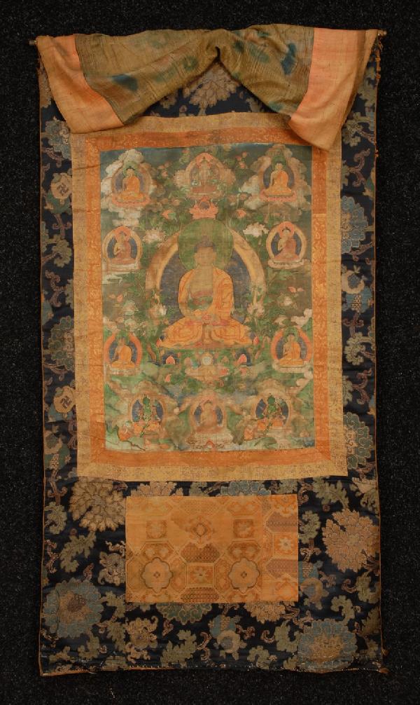 NEPALESE THANGKA, 18th C or EARLIER. Distemper on : NEPALESE THANGKA, 18th C or EARLIER. Distemper on cloth image of Shakyamuni Buddha seated in meditation position on lotus flower, surrounded by ten different mudra (mani- festations) of Buddha in vari