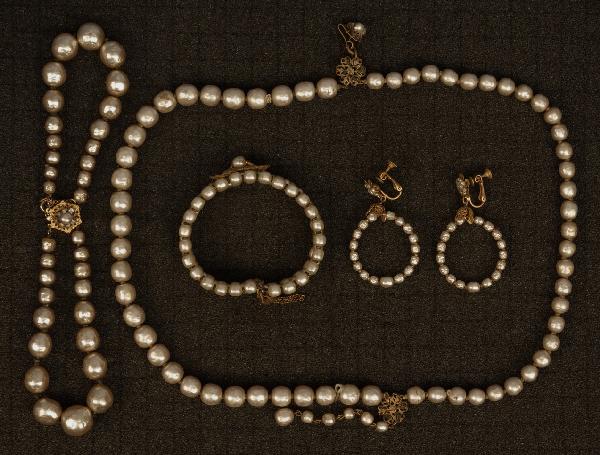 FOUR PIECES MIRIAM HASKELL FAUX BAROQUE PEARL JEW: FOUR PIECES MIRIAM HASKELL FAUX BAROQUE PEARL JEWELRY. All having brass filigree and signed. Two strand necklace and bracelet, both having large pearls, necklace 16. Spring bracelet with three rows of